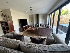 a living room with a couch and a table at The Beach Hut in Seasalter
