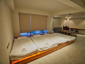 Letto o letti in una camera di Moon月行館海景民宿