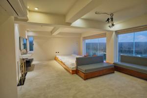 Letto o letti in una camera di Moon月行館海景民宿