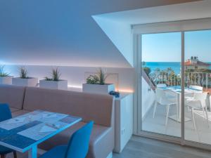 a living room with a couch and a table at Hotel Splendid in Diano Marina +234 photos