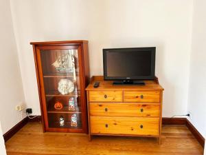 a television on top of a dresser in a room at Borja el Marino in Balmaseda
