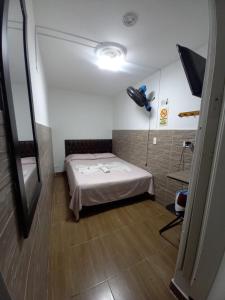 Postel nebo postele na pokoji v ubytování Hospedaje Ricaribe