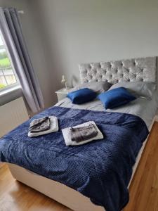Posteľ alebo postele v izbe v ubytovaní Pebble Dash House