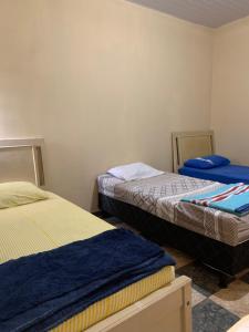Postel nebo postele na pokoji v ubytování Hotel Potiguar