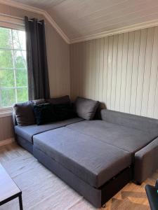 Ένα ή περισσότερα κρεβάτια σε δωμάτιο στο Villa Loftet, fin og moderne leilighet sentralt