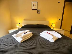 Ένα ή περισσότερα κρεβάτια σε δωμάτιο στο Traghetti House