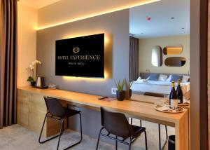 מיטה או מיטות בחדר ב-Hotel Experience