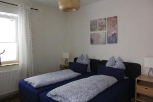 Katil atau katil-katil dalam bilik di Apartment Abtei Sayn