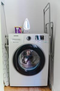 a washer and dryer in a room at Fantabulous Old Town Condo in Zagreb