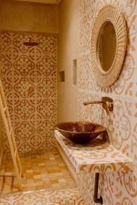 a bathroom with a sink and a mirror at Villa de luxe in Marrakech +29 photos