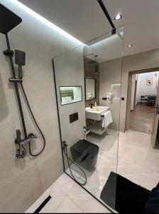 a bathroom with a shower and a sink at Centrico 13 Confort & Luxe au Centre in Tangier +13 photos