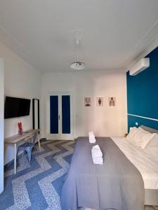 Letto o letti in una camera di The Place Strozzi