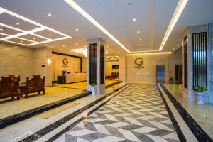 a lobby of a building with a lobby at Golden Quang Tri Hotel in Ðông Hà