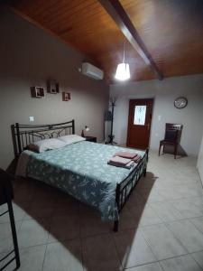 a bedroom with a large bed in a room at Seaview Maisonette Paradise in Pláka