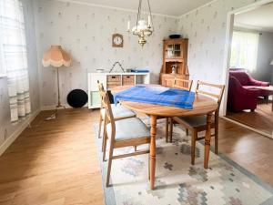a dining room table and chairs in a kitchen at 4 person holiday home in TINGSRYD in Tingsryd
