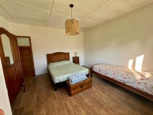 Una cama o camas en una habitación de Casa de campo