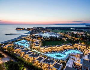 an aerial view of a resort at night at Sani Dunes in Sani Beach