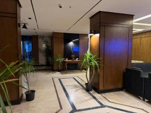 an office with potted plants in a lobby at Nuba Nile Hotel in Aswan