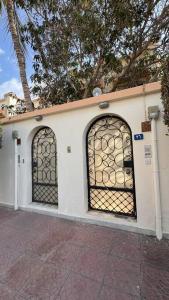 two gates on the side of a building at Elegant 3 bedrooms Villa Relax & Enjoy family only in Jeddah