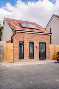 a house with a solar panel on the roof at Amias Homes in Cardiff
