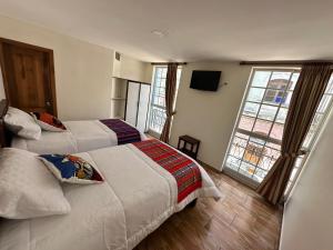 Letto o letti in una camera di Quito Basecamp - Adventure Hostel