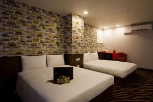 Voodi või voodid majutusasutuse Hotel 6 - ZhongHua toas