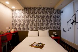 Voodi või voodid majutusasutuse Hotel 6 - ZhongHua toas