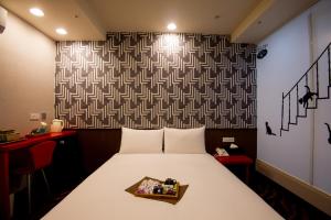 Voodi või voodid majutusasutuse Hotel 6 - ZhongHua toas