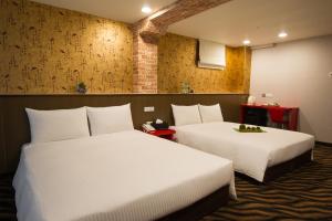 Voodi või voodid majutusasutuse Hotel 6 - ZhongHua toas