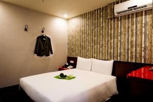 Voodi või voodid majutusasutuse Hotel 6 - ZhongHua toas