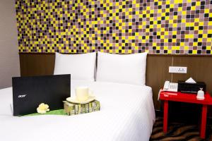 Voodi või voodid majutusasutuse Hotel 6 - ZhongHua toas