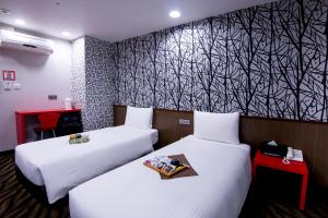 Voodi või voodid majutusasutuse Hotel 6 - ZhongHua toas