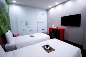 Voodi või voodid majutusasutuse Hotel 6 - ZhongHua toas