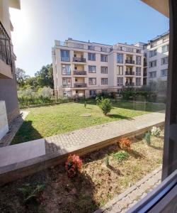 a view of a building from a window at Аpartment Van Gogh in Hisarya