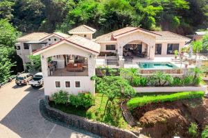 an aerial view of a house with a swimming pool at Luxurious 3 Bedroom Villa in Coco
