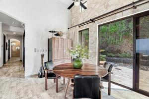 a dining room with a wooden table and chairs at Luxurious 3 Bedroom Villa in Coco
