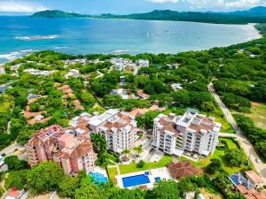 an aerial view of a resort near the ocean at Langosta Beach Ocean View Penthouse w Pool in Tamarindo