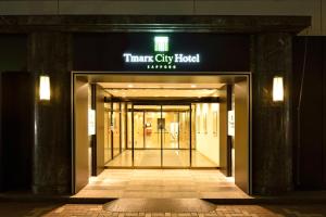 an entrance to a therapy city hotel at night at Tmark City Hotel Sapporo in Sapporo