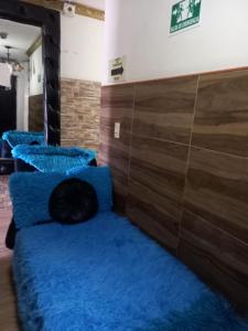Postel nebo postele na pokoji v ubytování Hospedaje Ricaribe