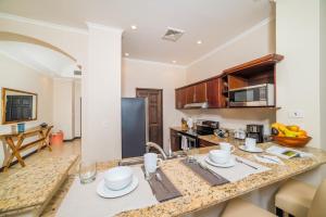 a kitchen with a sink and a counter top at Spectacular Ocean View Condo in Playa Flamingo