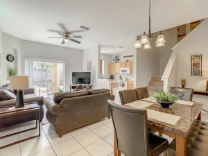 a living room with a couch and a table at Charming & Cozy Getaway! Lazy River! in Davenport