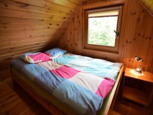 Ένα ή περισσότερα κρεβάτια σε δωμάτιο στο Holiday Home near Lake Mausz, Kashubia