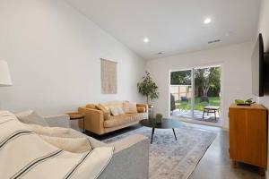 a living room with a couch and a table at Vienna's Modern Retreat in Rapid City