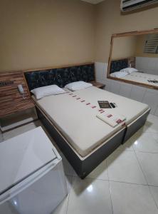 Postel nebo postele na pokoji v ubytování Hotel Flert Santana