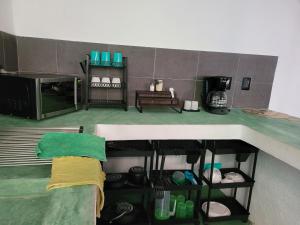 a view of a kitchen with a counter top at Departamento Miguel Angel in Oaxaca City +13 photos