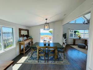 a dining room with a table and chairs at Ocean and Sunset Views - Cliff Side Cottage in Bodega Bay