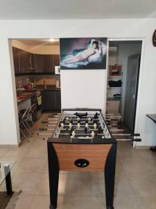 a room with a table with a chess game on it at Departamento en pueblan puebla colonial in El Gallinero +7 photos