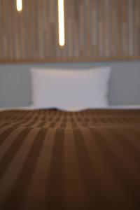 Postel nebo postele na pokoji v ubytování Belmont Hotel