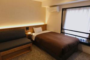 Postel nebo postele na pokoji v ubytování Belmont Hotel