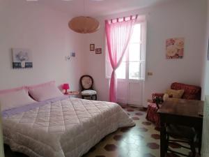 Posteľ alebo postele v izbe v ubytovaní Residenza Le Ortensie